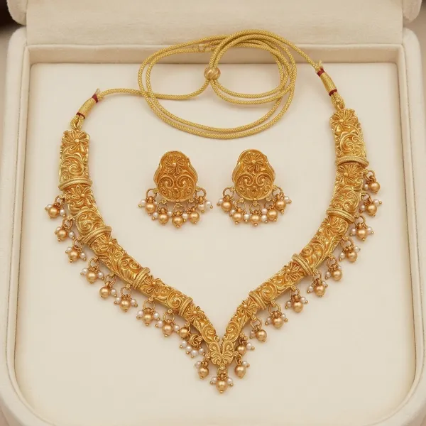 Gold_Alloy_Floral_Paisley_Pearl_Drop_Necklace_Set_With_Earrings