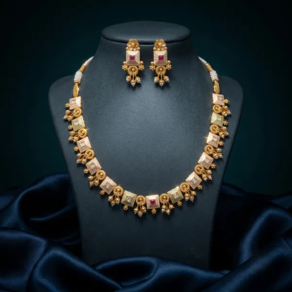 Gold_Alloy_Elephant_Motif_Pink_Stone_Necklace_Set_For_Women