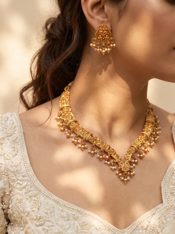 Gold_Alloy_Floral_Paisley_Pearl_Drop_Necklace_Set_With_Earrings