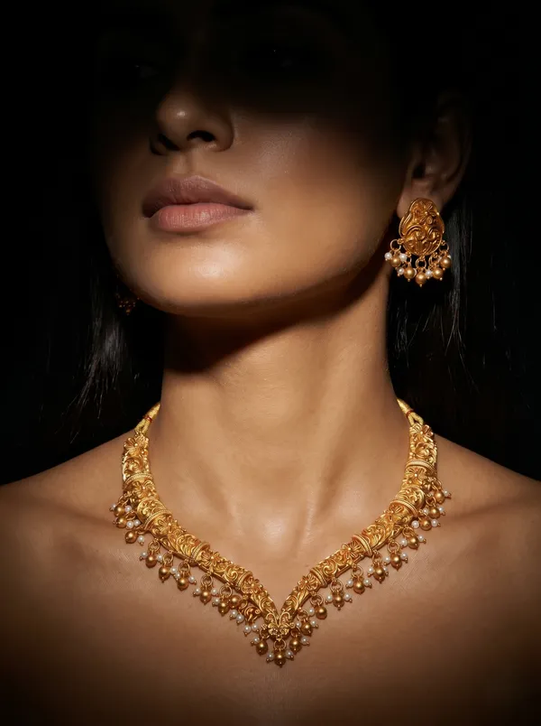 Gold_Alloy_Floral_Paisley_Pearl_Drop_Necklace_Set_With_Earrings
