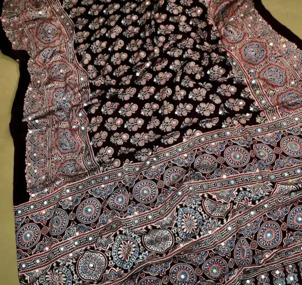 TRANDING_BLACK_AJARAKH_BUTTA_LOTUS_MODAL_SILK_MIRROR_WORK_PREMIUM_SAREE_FOR_WOMEN