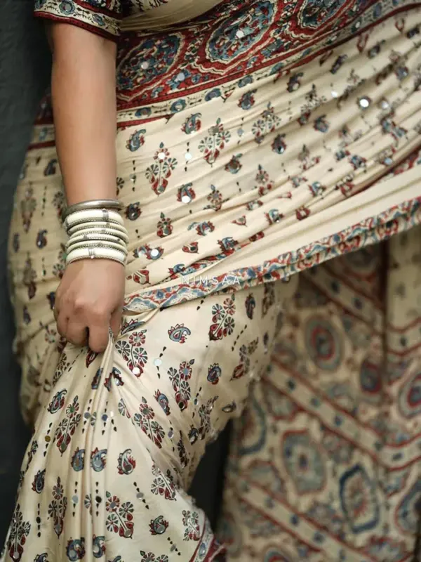 TRANDING_CREAM_AJARAKH_MODAL_SILK_MIRROR_WORK_PREMIUM_SAREE_FOR_WOMEN
