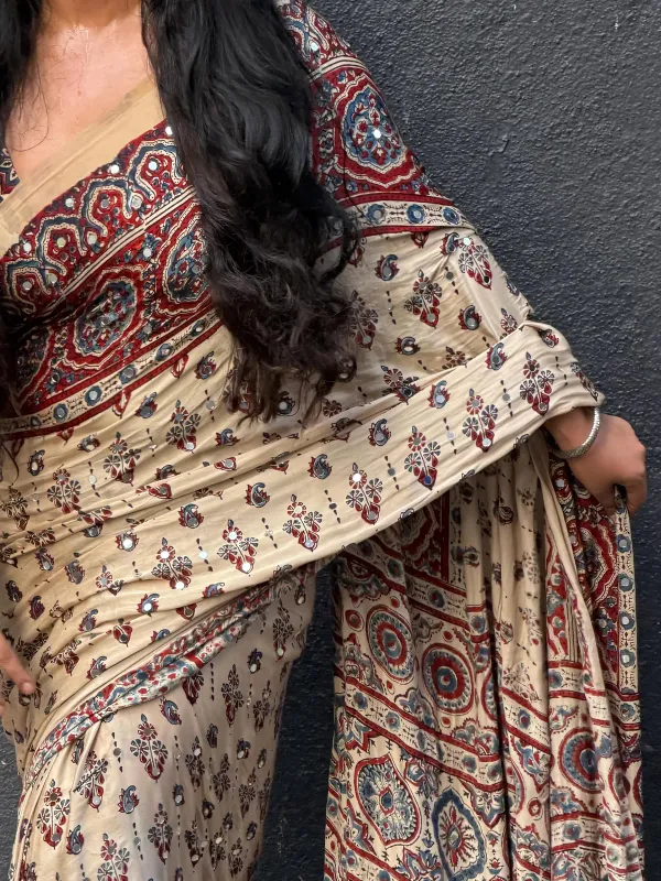 TRANDING_CREAM_AJARAKH_MODAL_SILK_MIRROR_WORK_PREMIUM_SAREE_FOR_WOMEN