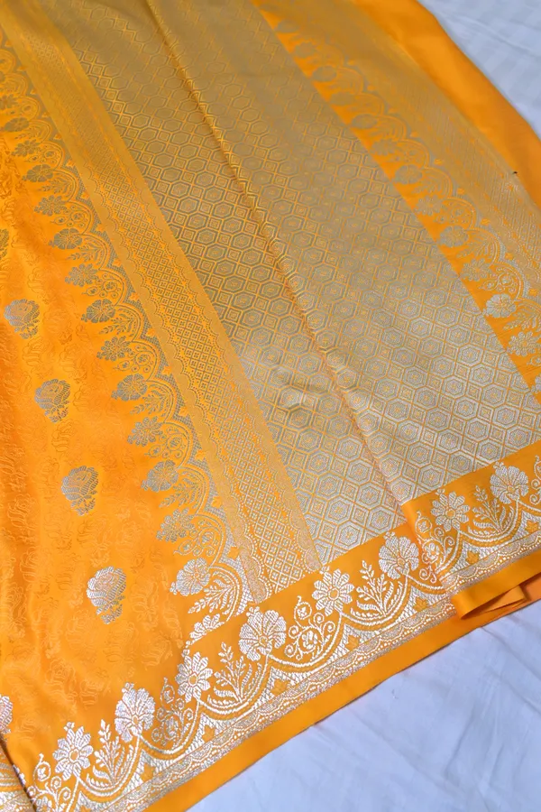 Premium_Yellow_Katan_Banarasi_Silk_Saree_With_Silver_Zari_Floral_Buta_Traditional_Wedding_Festive_Wear