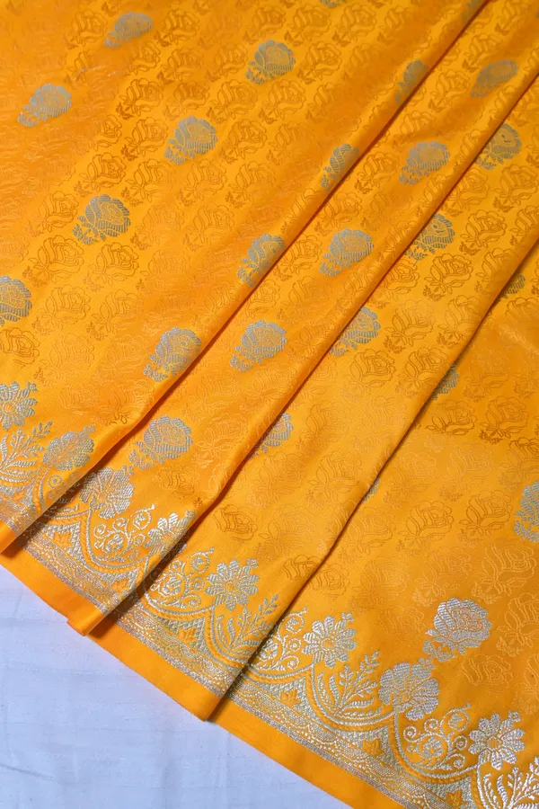 Premium_Yellow_Katan_Banarasi_Silk_Saree_With_Silver_Zari_Floral_Buta_Traditional_Wedding_Festive_Wear