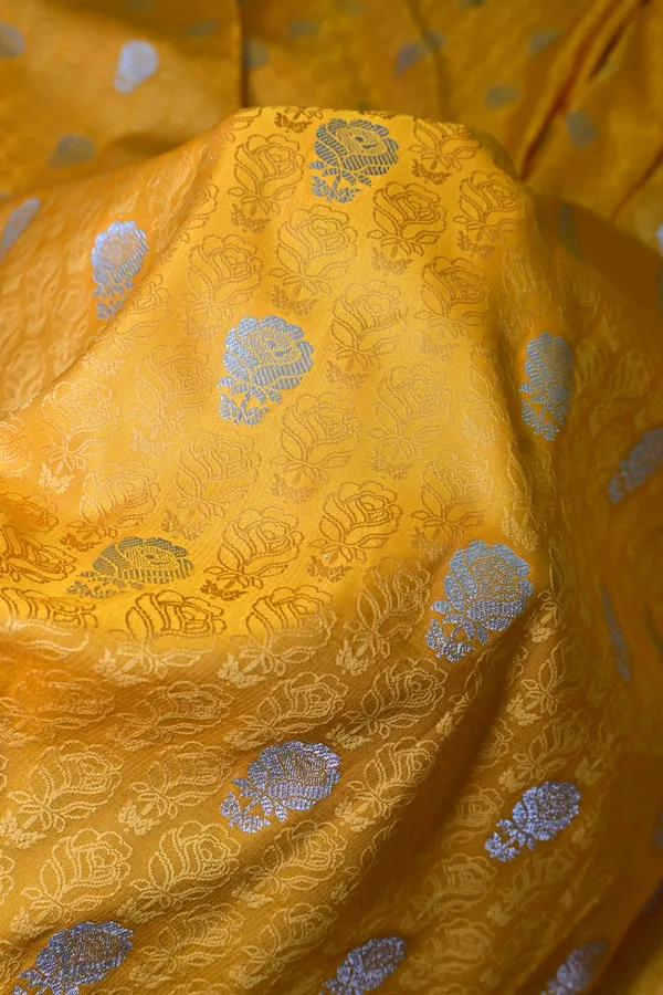 Premium_Yellow_Katan_Banarasi_Silk_Saree_With_Silver_Zari_Floral_Buta_Traditional_Wedding_Festive_Wear