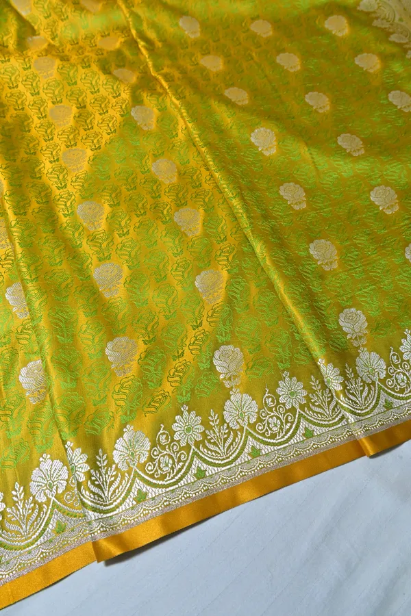 Premium_Lime_Green_Katan_Banarasi_Silk_Saree_With_Silver_Zari_Floral_Buta_Traditional_Wedding_Festive_Wear