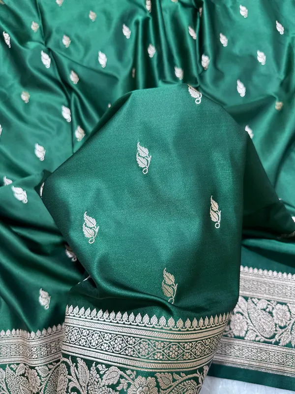 Bottle_Green_Katan_Silk_Banarasi_Saree_With_Heritage_Copper_Zari_Kalka_Bel_Border_And_Sleek_Leaf_Sprigs
