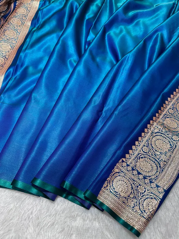 Royal_Peacock_Blue_Satin_Silk_Banarasi_Saree_With_Royal_Guldasta_Chakra_Border_And_Bold_Gold_Panna_Butis