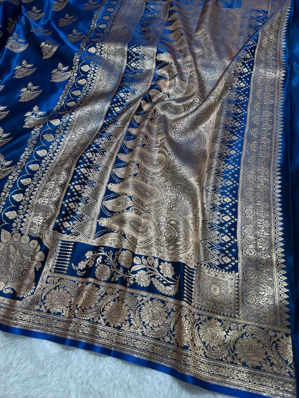 Royal_Peacock_Blue_Satin_Silk_Banarasi_Saree_With_Royal_Floral_Jhallar_Border_And_Royal_Peacock_Paisley_Butis