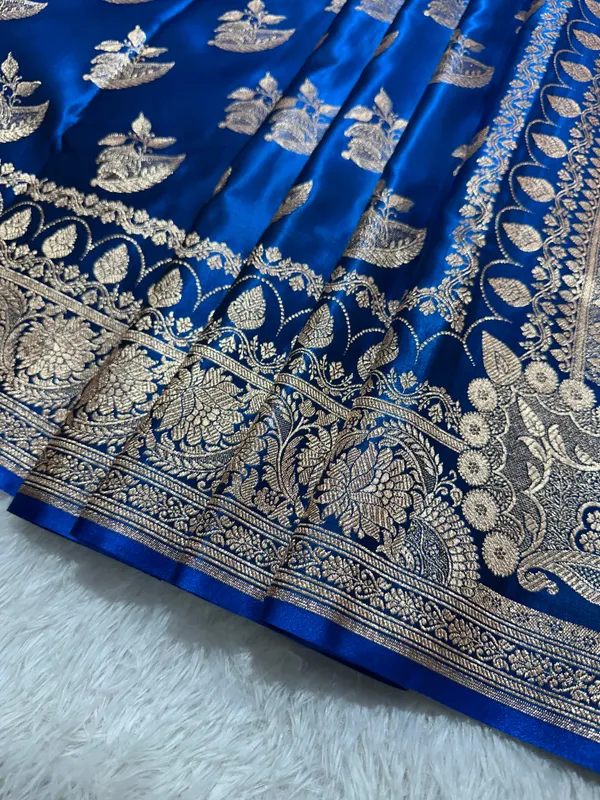 Royal_Peacock_Blue_Satin_Silk_Banarasi_Saree_With_Royal_Floral_Jhallar_Border_And_Royal_Peacock_Paisley_Butis