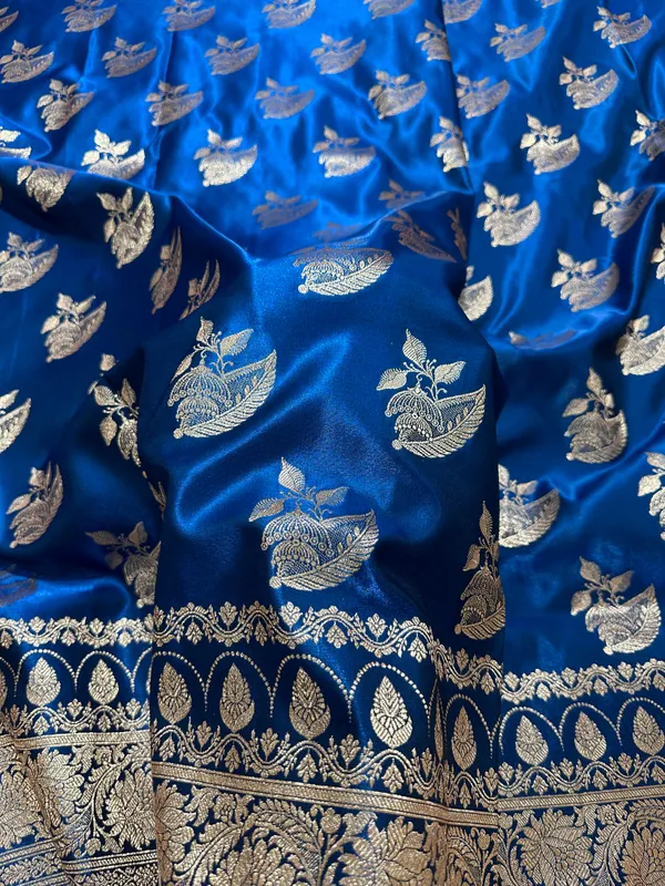 Royal_Peacock_Blue_Satin_Silk_Banarasi_Saree_With_Royal_Floral_Jhallar_Border_And_Royal_Peacock_Paisley_Butis