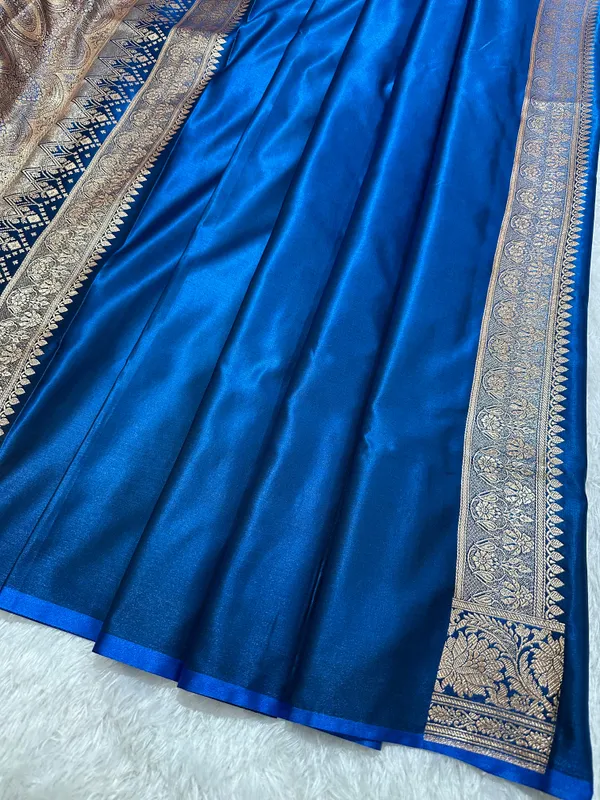 Royal_Peacock_Blue_Satin_Silk_Banarasi_Saree_With_Royal_Floral_Jhallar_Border_And_Royal_Peacock_Paisley_Butis