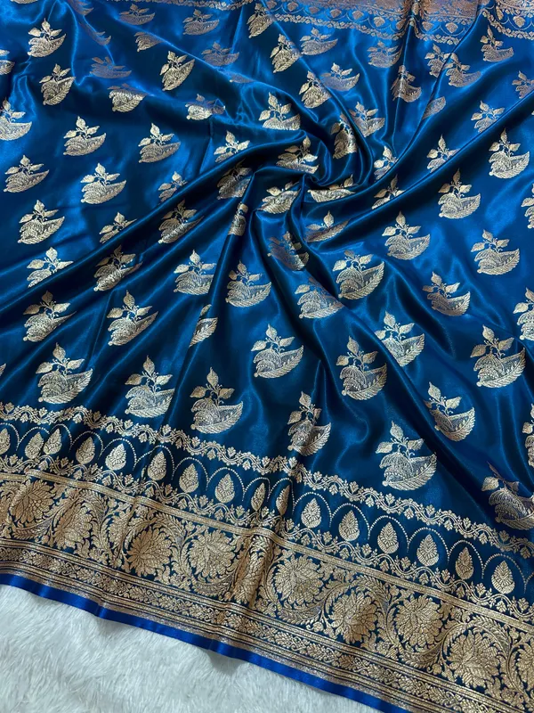 Royal_Peacock_Blue_Satin_Silk_Banarasi_Saree_With_Royal_Floral_Jhallar_Border_And_Royal_Peacock_Paisley_Butis