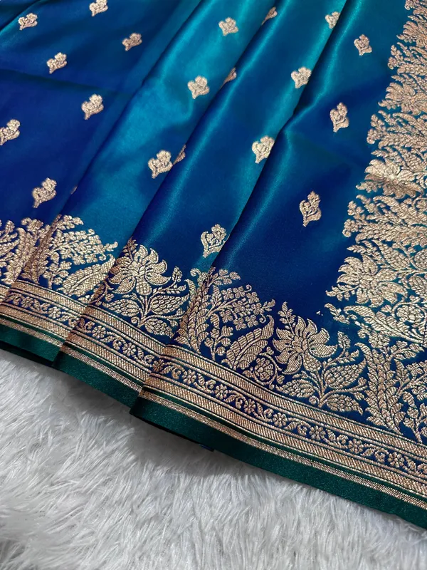 Royal_Peacock_Blue_Satin_Silk_Banarasi_Saree_With_Delicate_Floral_Arch_Border_And_Traditional_Kalka_Butis