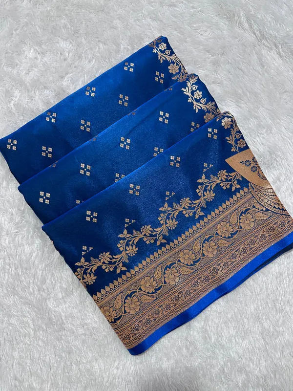 Royal_Peacock_Blue_Satin_Silk_Banarasi_Saree_With_Royal_Floral_Jhallar_Border_And_Geometric_Chowk_Butis