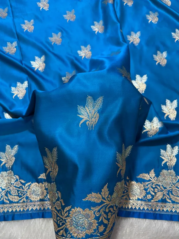 Elegant_Firozi_Blue_Katan_Silk_Banarasi_Saree_With_Delicate_Floral_Arch_Border_And_Traditional_Bouquet_Leaf_Butis