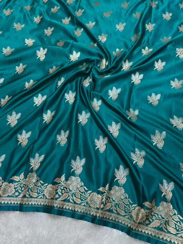 Premium_Peacock_Blue_Katan_Silk_Banarasi_Saree_With_Delicate_Floral_Arch_Border_And_Traditional_Bouquet_Leaf_Butis