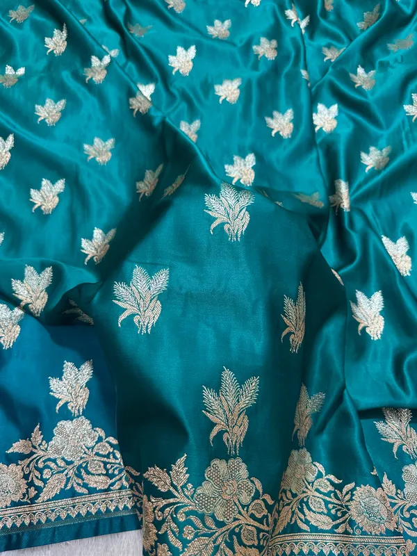 Premium_Peacock_Blue_Katan_Silk_Banarasi_Saree_With_Delicate_Floral_Arch_Border_And_Traditional_Bouquet_Leaf_Butis