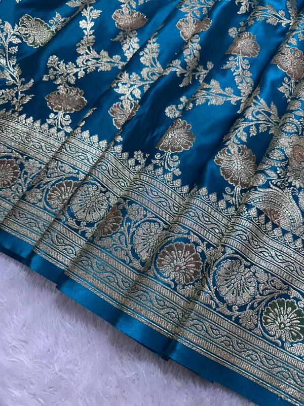 Premium_Peacock_Blue_Katan_Silk_Banarasi_Saree_With_Traditional_Floral_Vine_Jaal_And_Ornate_Zari_Border