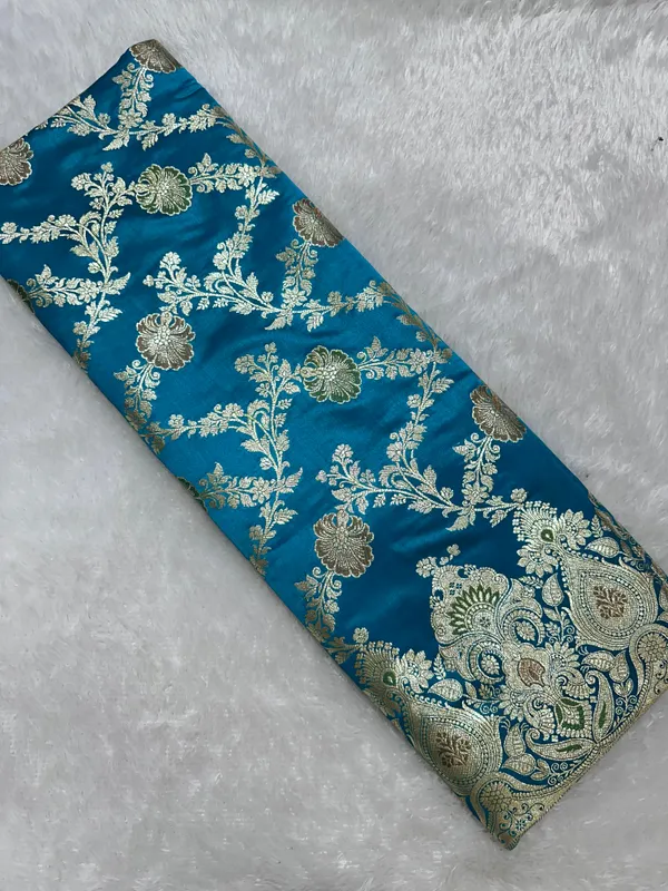 Premium_Peacock_Blue_Katan_Silk_Banarasi_Saree_With_Traditional_Floral_Vine_Jaal_And_Ornate_Zari_Border