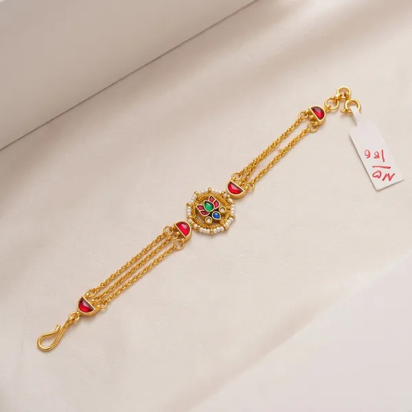 Gold_Kundan_Rakhi_Bracelet_With_Red_Green_Stones_For_Women