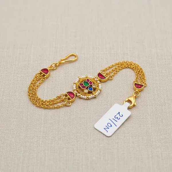 Gold_Kundan_Rakhi_Bracelet_With_Red_Green_Stones_For_Women