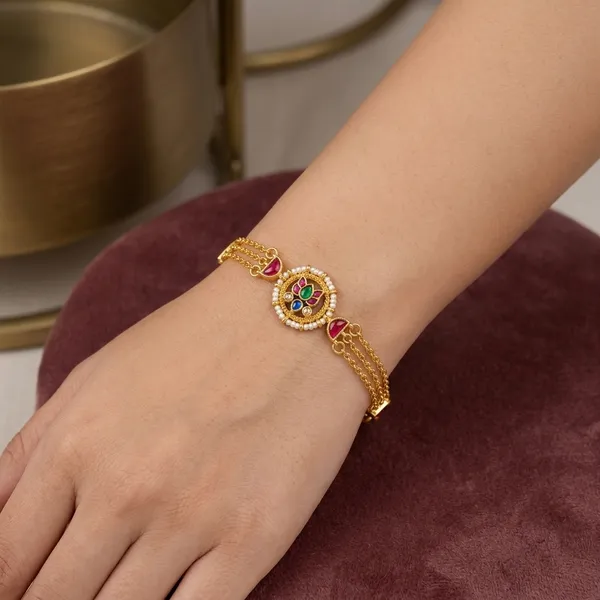 Gold_Kundan_Rakhi_Bracelet_With_Red_Green_Stones_For_Women