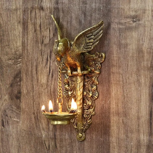 Brass_Peacock_Motif_Wall-Mounted_Diya_Holder
