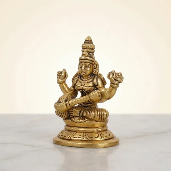 Brass_Goddess_Saraswati_Seated_On_Lotus_Idol