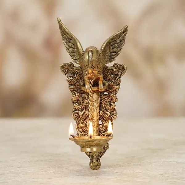 Brass_Peacock_Motif_Wall-Mounted_Diya_Holder