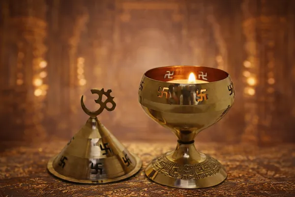 Brass_Om_Swastik_Akhand_Diya_With_Conical_Lid