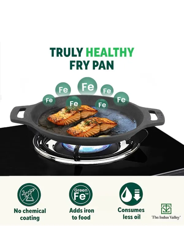 Cast_Iron_Fry_Pan_With_Wooden_Spatula