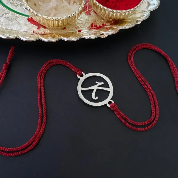 Round_Initial_Rakhi