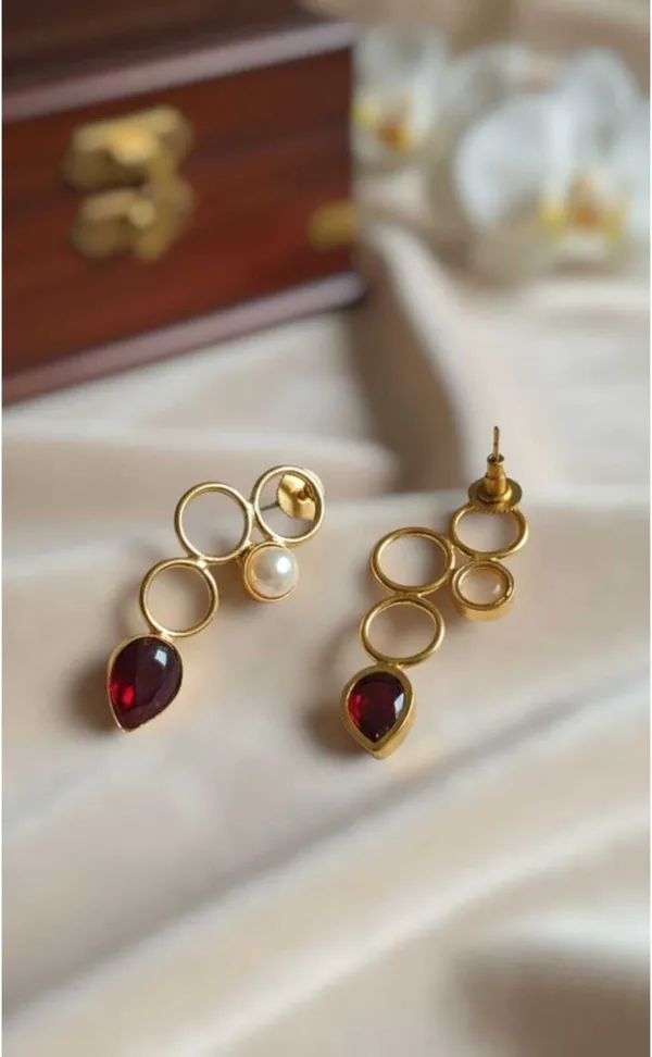 Gold_Maroon_Brass_Interlocking_Circle_Ruby_Pearl_Drop_Danglers_For_Women