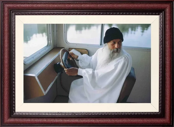 Acharya_Rajneesh_Osho_Driving_A_Boat_Without_Glass_|_Light_Through_the_Glass_Frame