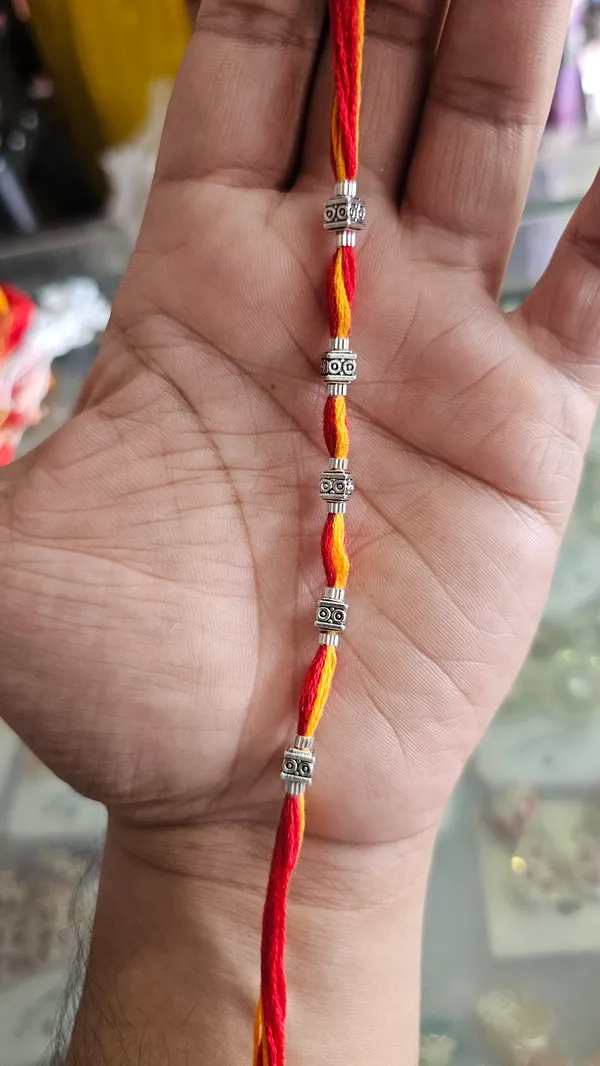 Red_Yellow_Twisted_Thread_Rakhi_With_Silver_Beads_Pack_Of_3