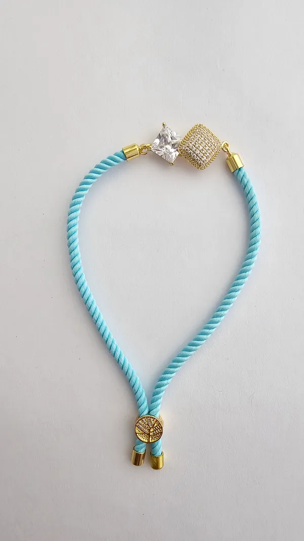 Turquoise_Corded_Gold_Studded_Charm_Rakhi
