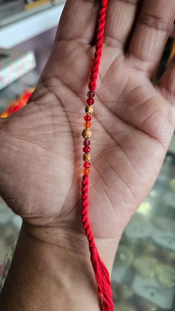Red_Thread_Rakhi_With_Golden_And_Red_Beads_Pack_Of_6