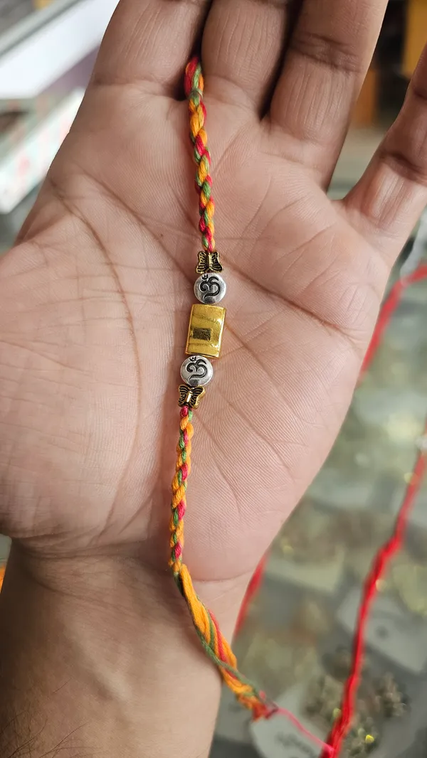Multicolor_Braided_Thread_Rakhi_With_Silver_And_Gold_Beads_Pack_Of_4