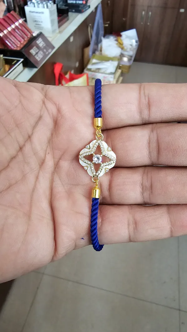 Blue_Cord_Gold_Clover_Charm_Adjustable_Rakhi