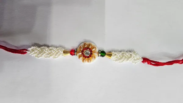 Pearl_Beaded_Floral_Rakhi_With_Red_Thread