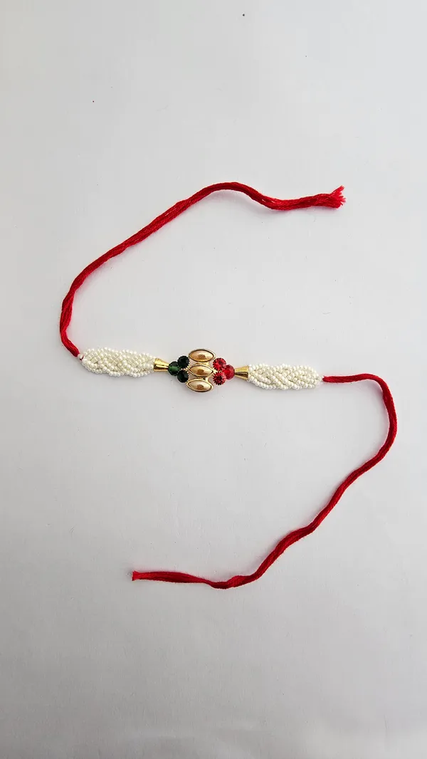 Pearl_Beaded_Gold_Motif_Rakhi_With_Red_Thread