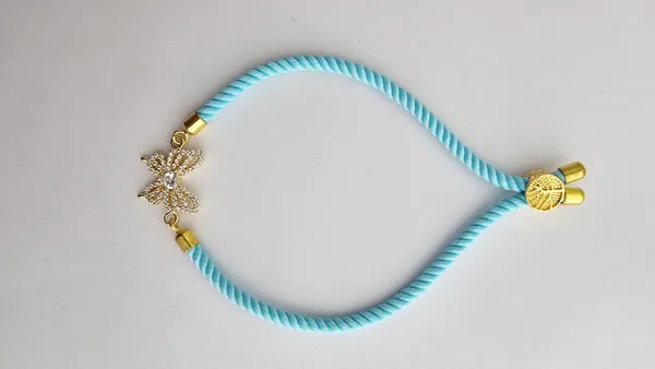 Turquoise_Cord_Gold_Toned_Butterfly_Charm_Rakhi