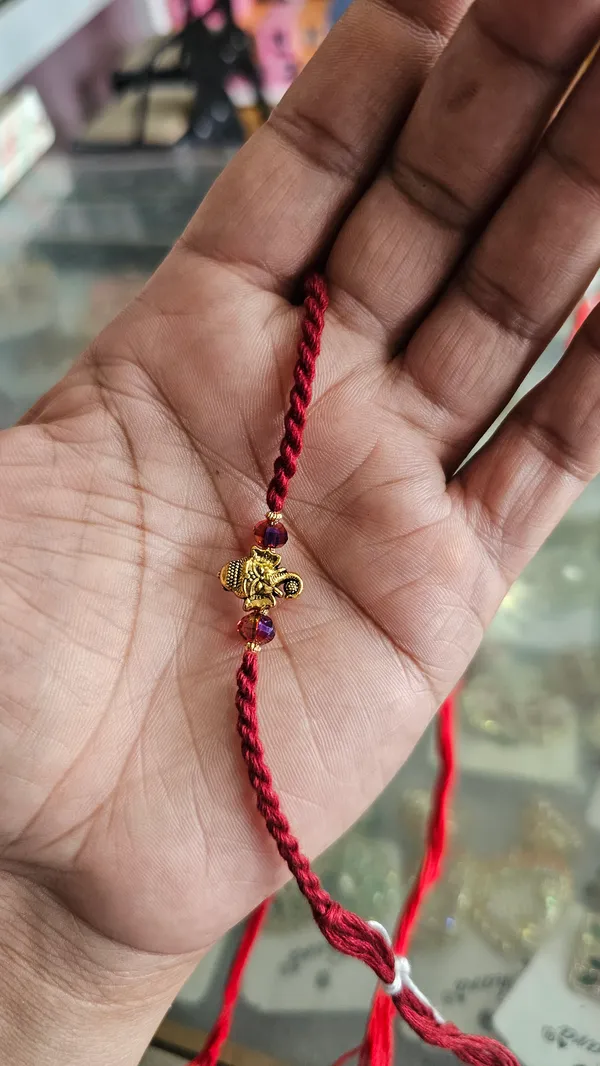 Red_Braided_Thread_Rakhi_With_Golden_Ganesha_Charm_Pack_Of_3