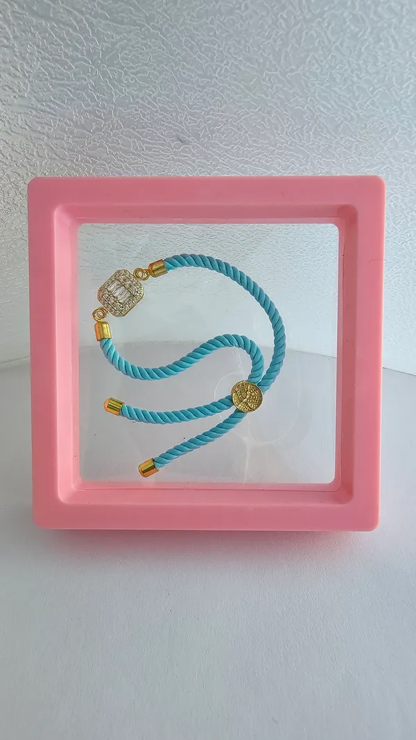 Turquoise_Cord_Gold_Toned_Studded_Charm_Rakhi