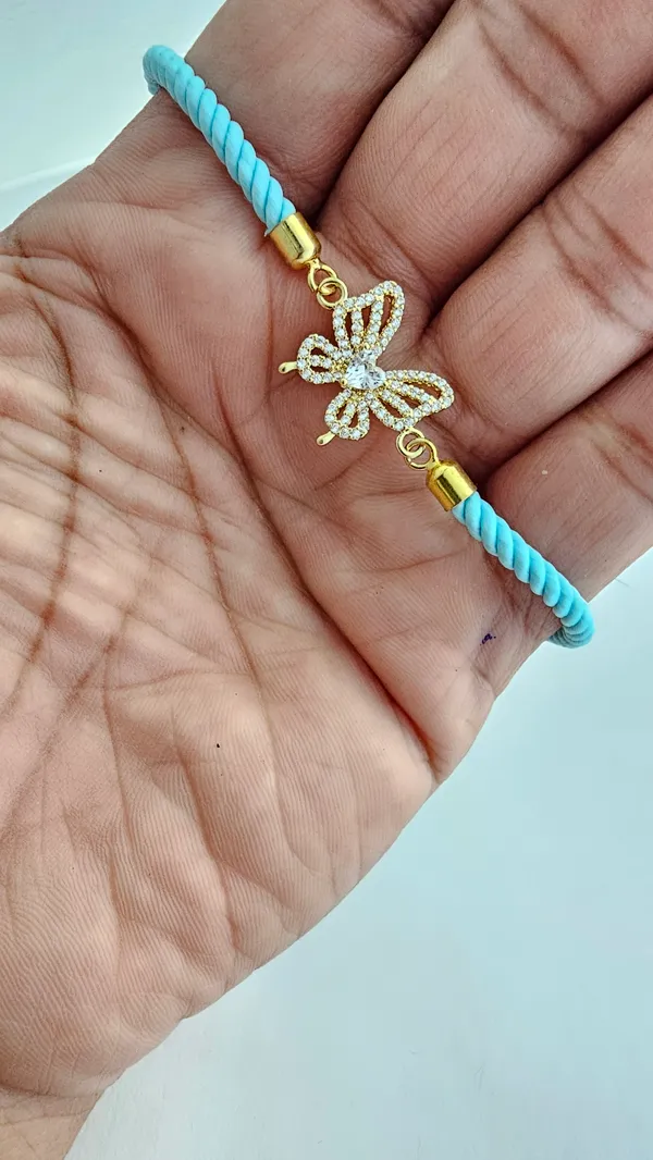 Turquoise_Cord_Gold_Toned_Butterfly_Charm_Rakhi