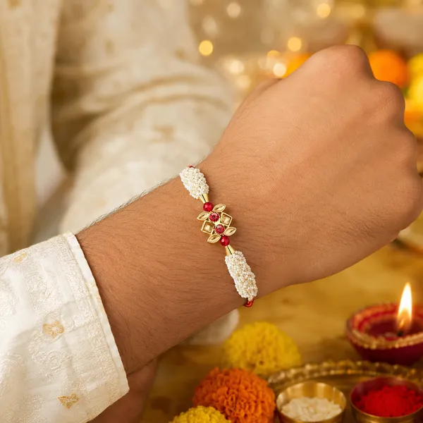 Pearl_Beaded_Golden_Floral_Rakhi_With_Red_Stones