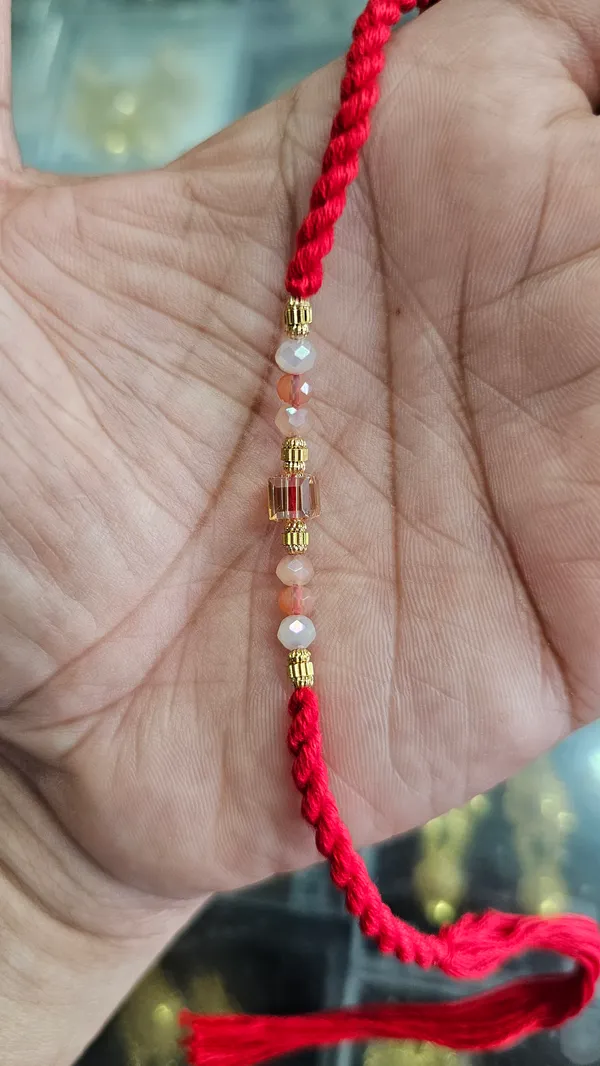Red_Thread_Rakhi_With_Pearl_And_Gold_Beads_Brother_Pack_Of_6