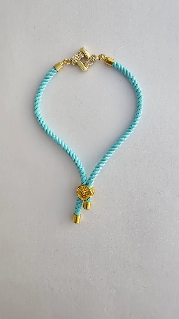 Turquoise_Cord_Gold_Charm_Adjustable_Rakhi